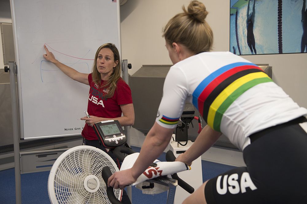 Physiologist Lindsey Hymen with women's team pursuit members.