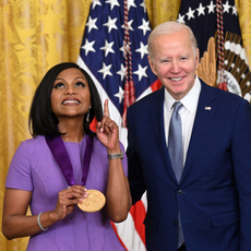 US President Joe Biden awards actress Mindy Kaling with the 2021 National Medal of Arts during a ceremony in the East Room of the White House in Washington, DC, March 21, 2023