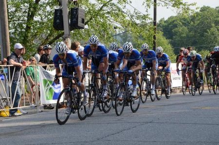 The UnitedHealthcare Blue Train on the front of the pack with 3 laps to go.
