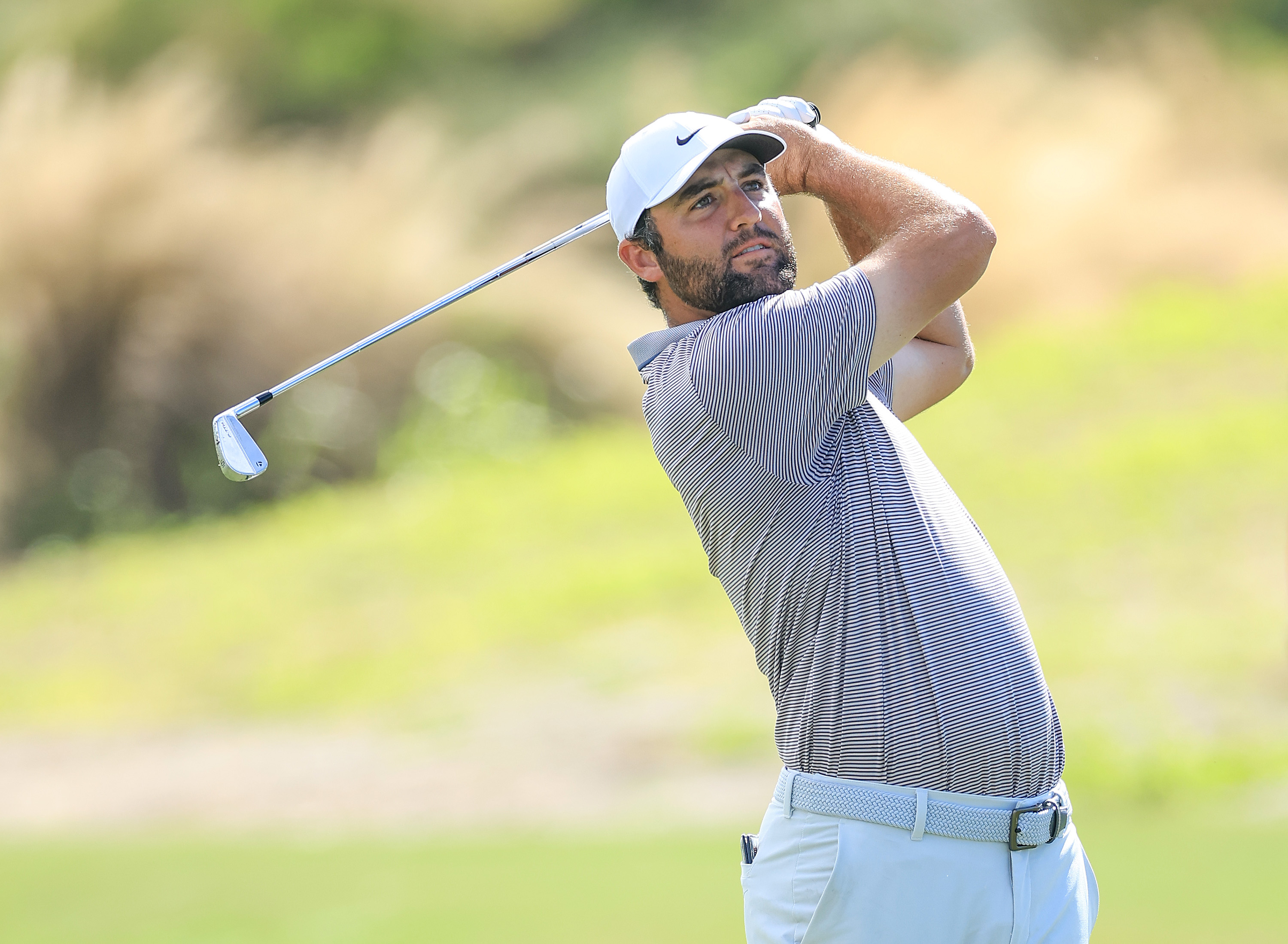 Scottie Scheffler hits an iron