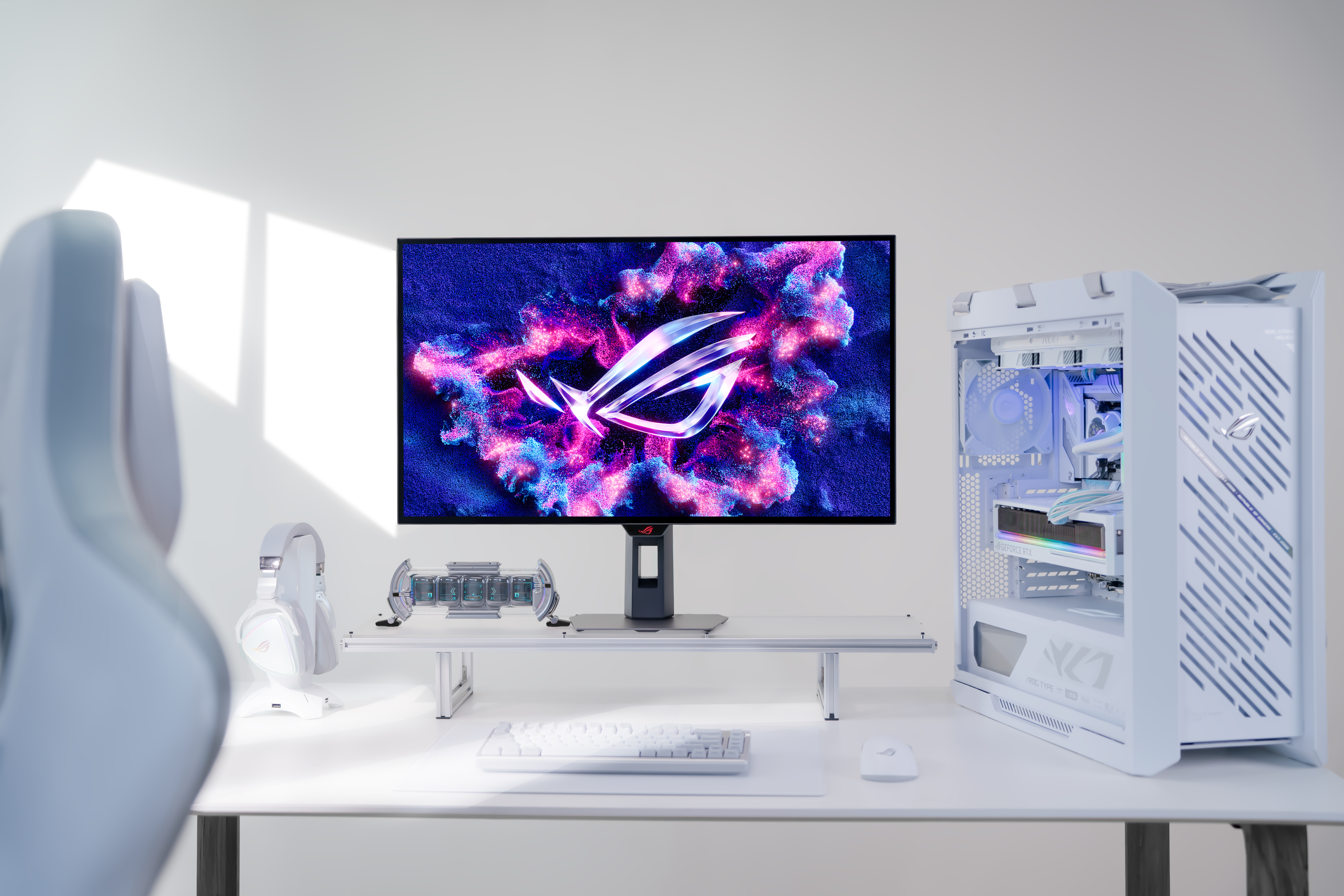 Asus monitor on desk with gaming PC