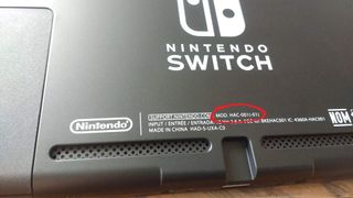 Model code on the backside of a Nintendo Switch V2