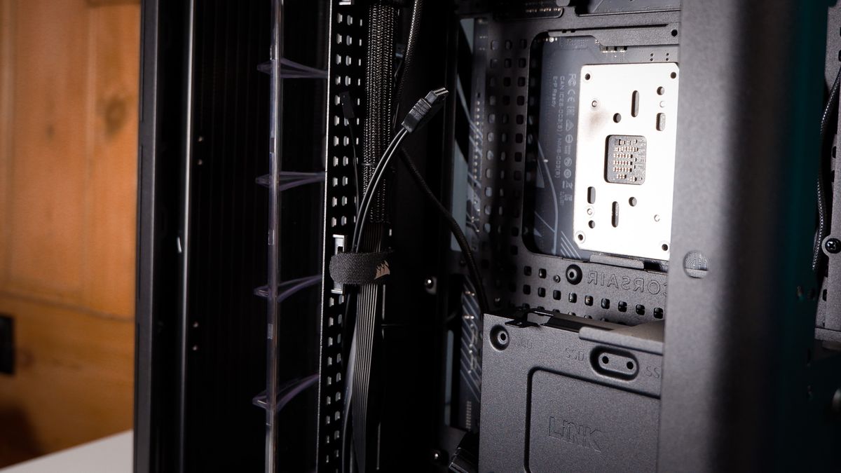 A Corsair Air 5400 PC case on a desk with various parts installed.