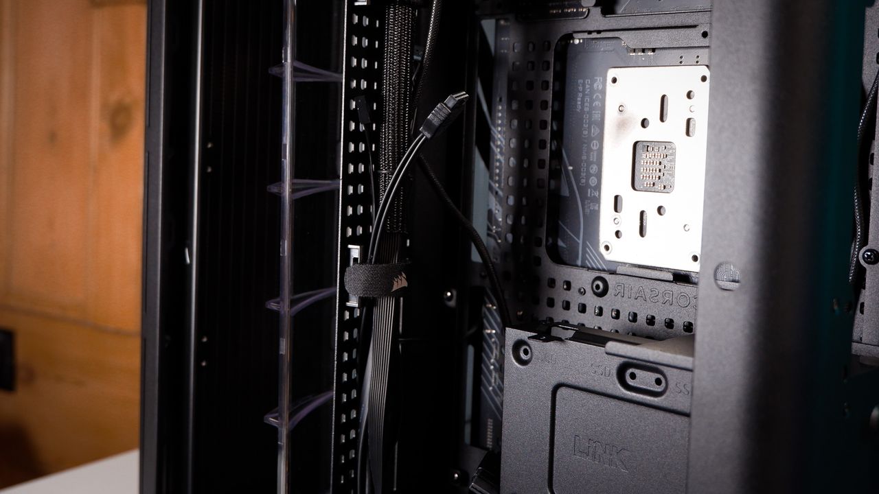 A Corsair Air 5400 PC case on a desk with various parts installed.
