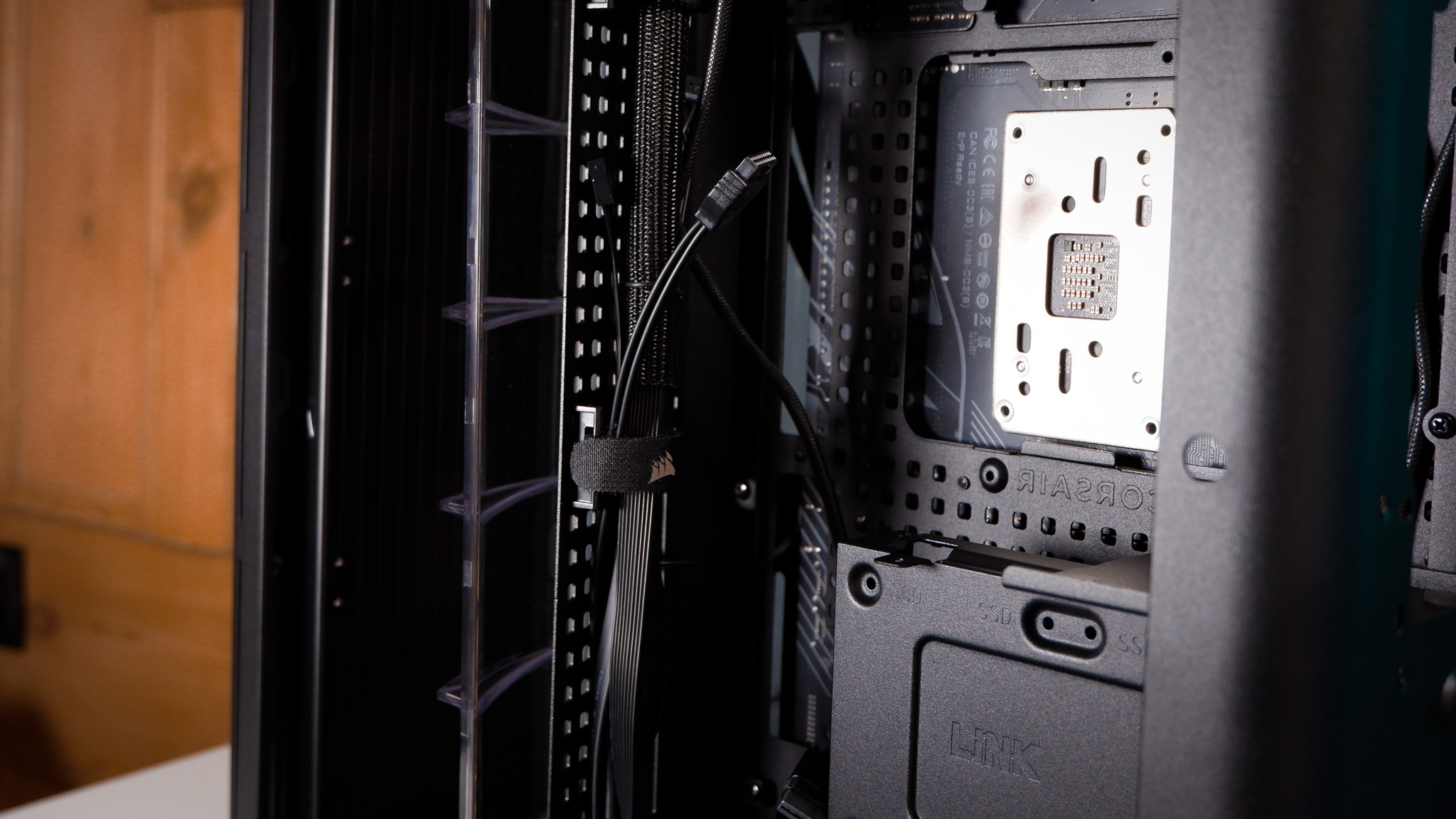 A Corsair Air 5400 PC case on a desk with various parts installed.