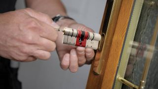 Someone installing a smart lock