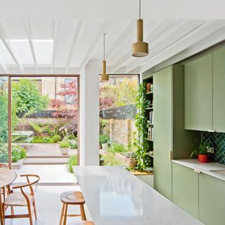 kitchen extension with a green modern kitchen
