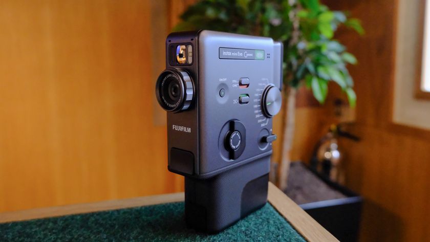 A black Fujifilm Instax mini Evo Cinema hybrid instant camera