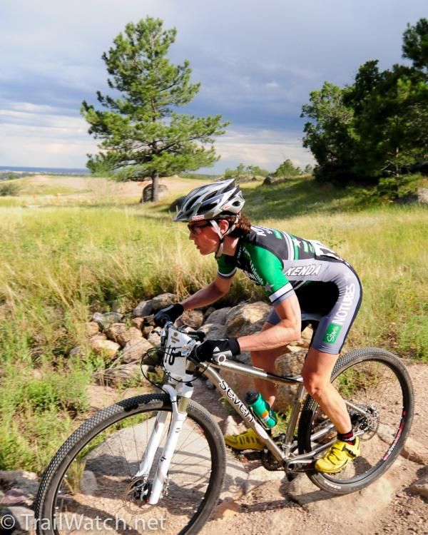 Mary McConneloug (Kenda-Seven-No Tubes) rides an open section of the course before the final descent