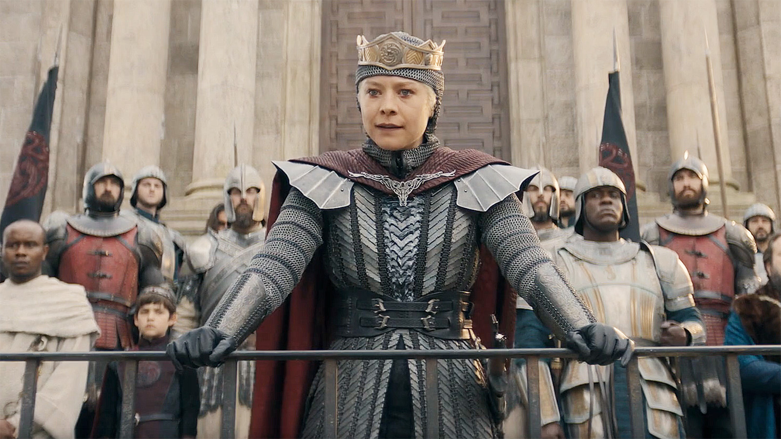 Rhaenyra Targaryen flanked by guards and leaning on a rail in House of the Dragon season 3 episode 8