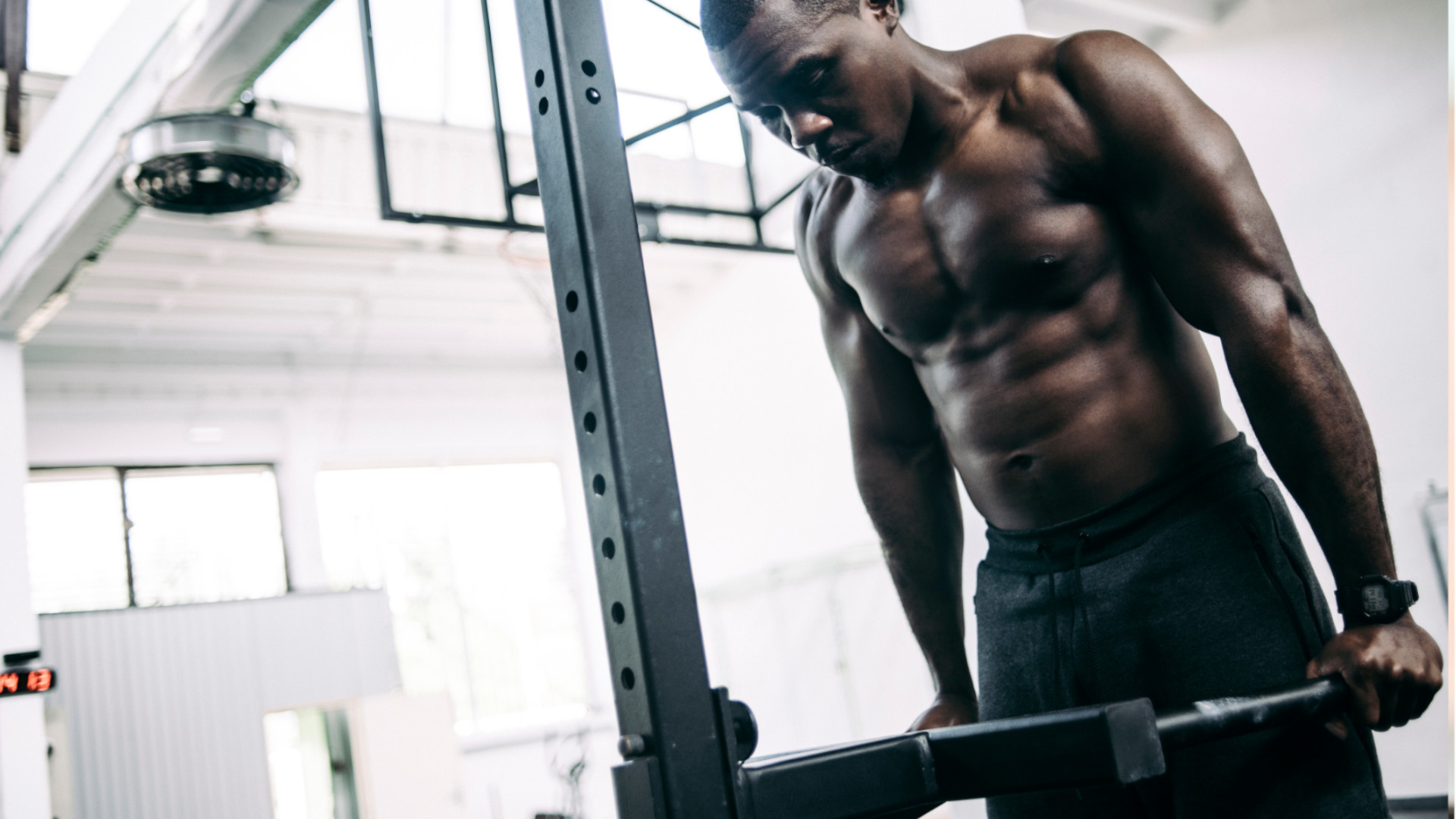 A man performing dips at the gym
