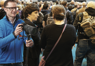 Composite of Digital Camera Magazine editor Niall Hampton and crowd at the photography and video show