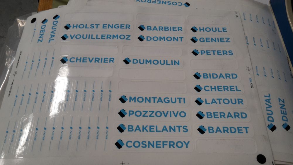 Mechanics will attach these stickers to the riders' bikes