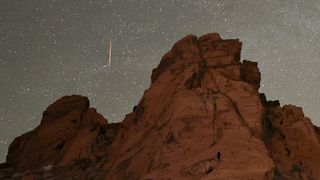 A tau Herculids meteor streaks above sandstone formations at the Valley of Fire State Park, Nevada on May 30, 2022.