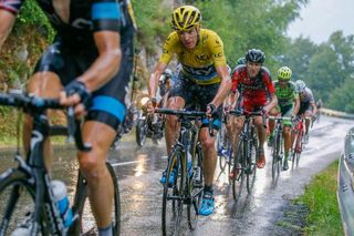 Chris Froome rides in the rain during stage 12.