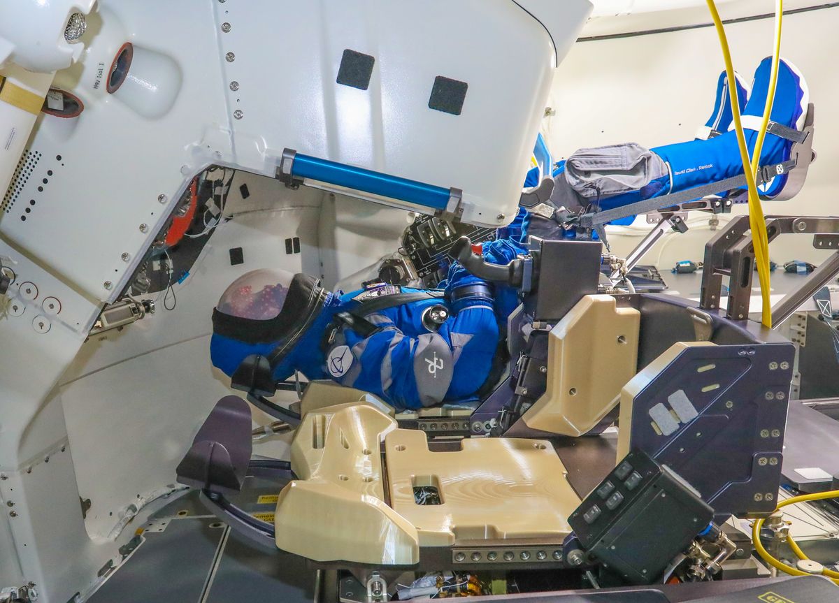 An anthropomorphic test device or flight dummy nicknamed Rosie the Rocketeer appears strapped into a seat in Boeing&#039;s Starliner capsule before the vehicle&#039;s second uncrewed flight test, scheduled to launch on July 30, 2021.