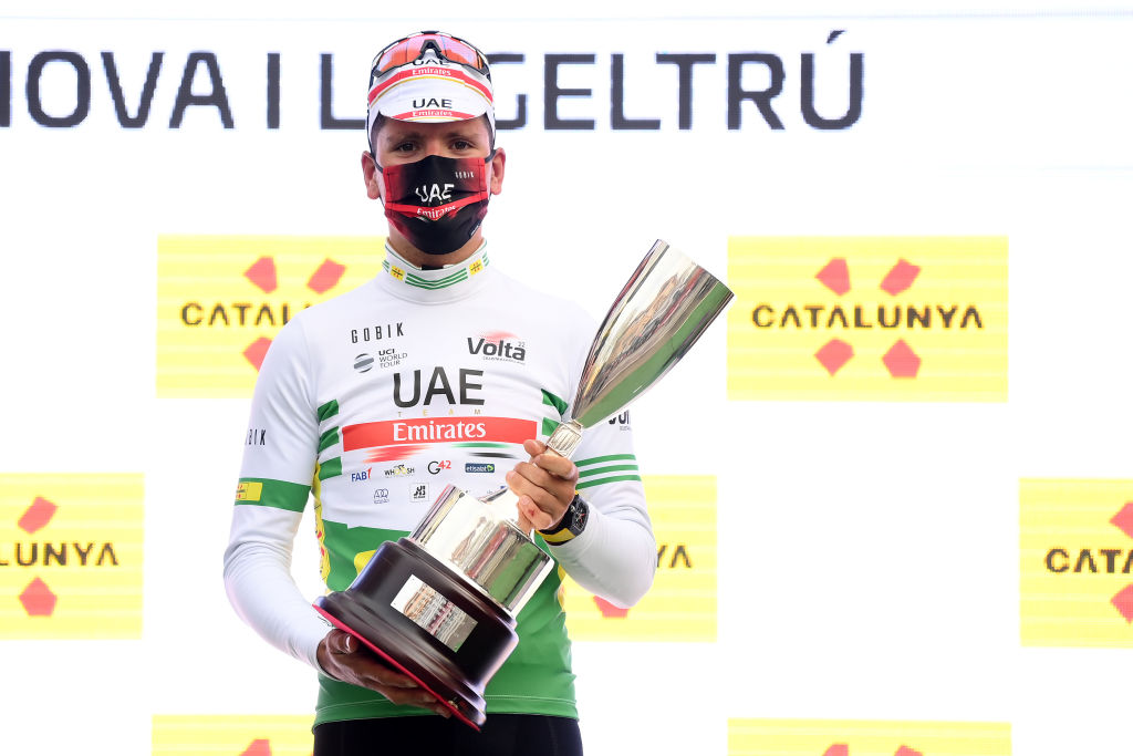 VILANOVA I LA GELTRU SPAIN MARCH 25 Joo Almeida of Portugal and UAE Team Emirates celebrates winning the green leader jersey on the podium ceremony after during the 101st Volta Ciclista a Catalunya 2022 Stage 5 a 2063km stage from La Pobla de Segur to Vilanova i la Geltr VoltaCatalunya101 WorldTour on March 25 2022 in Vilanova i la Geltru Spain Photo by David RamosGetty Images
