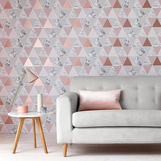 livig room with wallpaper and grey sofa