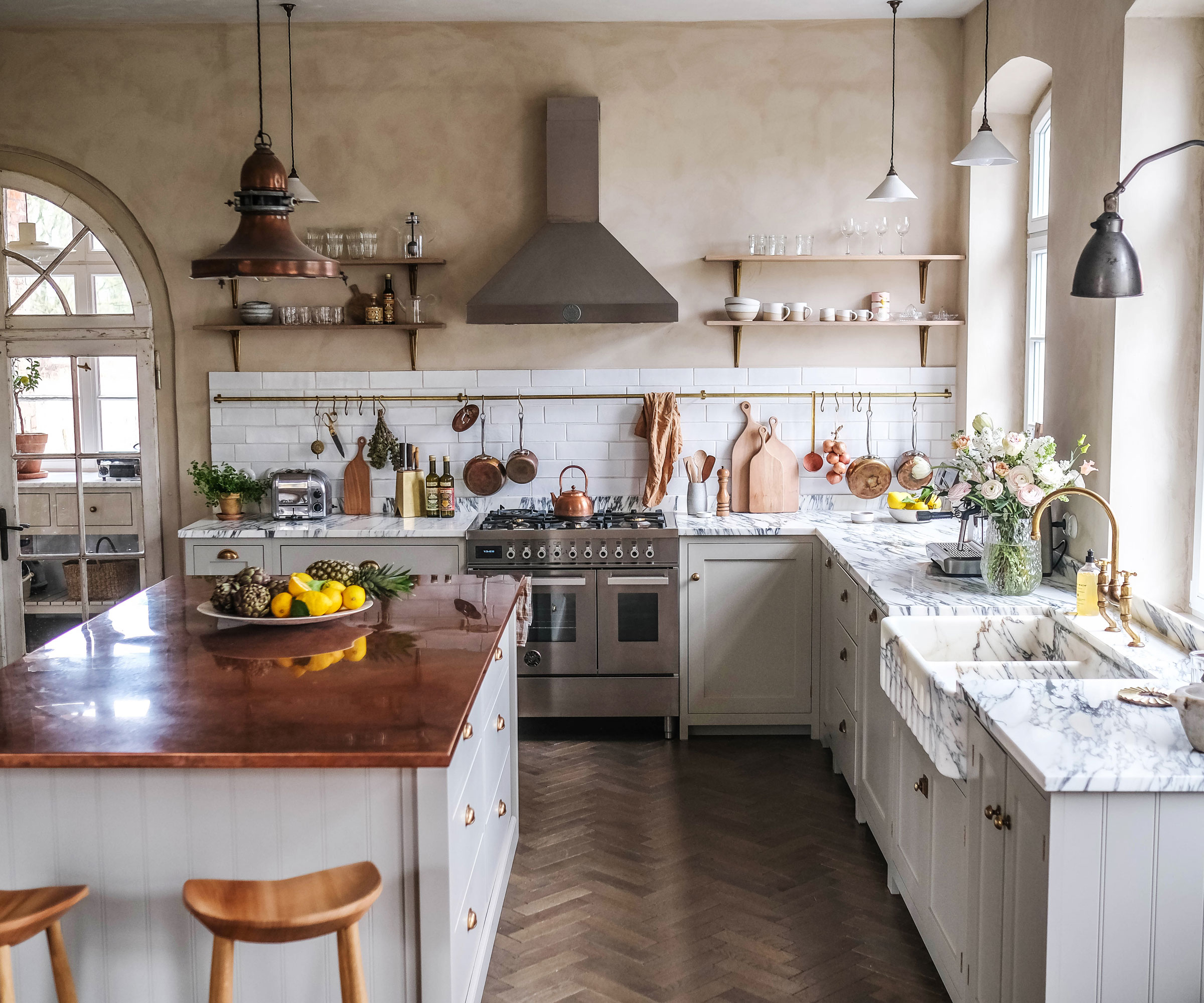 modern rustic kitchen with copper worktop and marble worktops