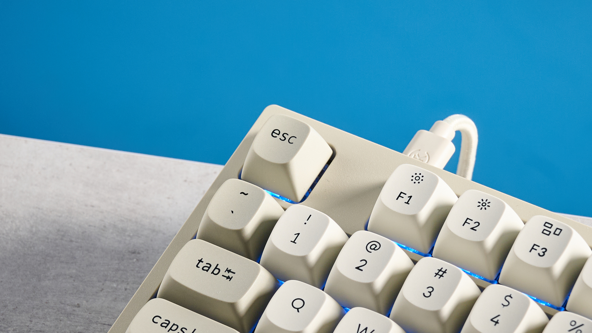 Keychron C1 Pro 8K photographed in front of a blue background.