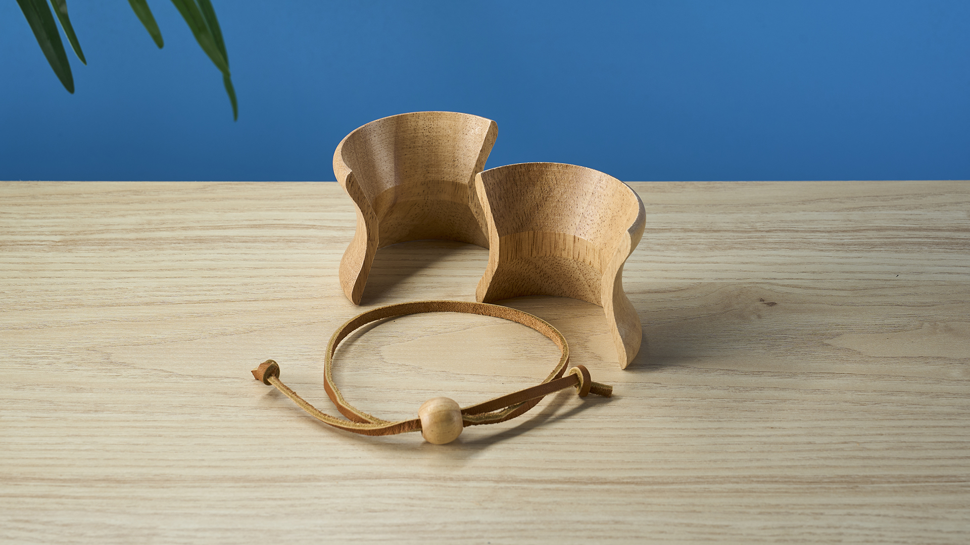 a 6-cup hourglass coffee maker from Chemex and a wooden collar with a rawhide tie