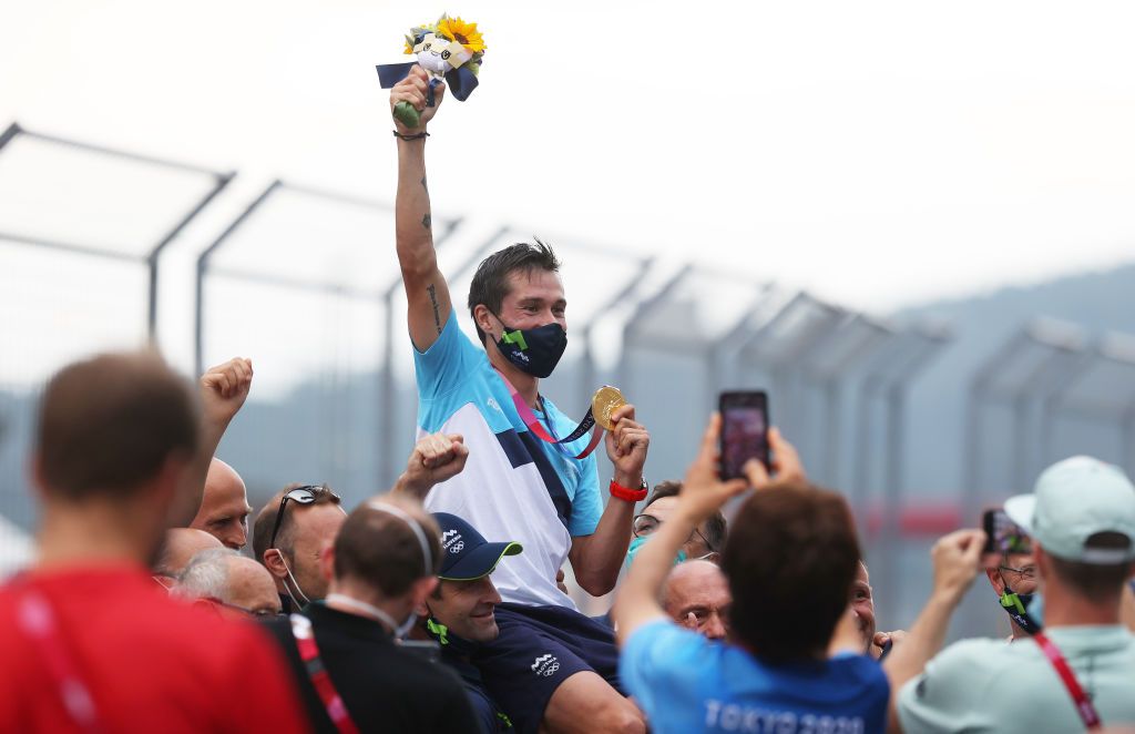 OYAMA JAPAN JULY 28 Gold medalist Primoz Roglic of Team Slovenia is lifted up by his team to celebrate their victory after the Mens Individual time trial on day five of the Tokyo 2020 Olympic Games at Fuji International Speedway on July 28 2021 in Oyama Shizuoka Japan Photo by Michael SteeleGetty Images