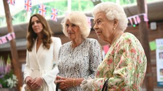 Catherine, Duchess of Cambridge (L), Camilla, Duchess of Cornwall (C) and Queen Elizabeth II meet people from communities across Cornwall at an event in celebration of The Big Lunch initiative at The Eden Project during the G7 Summit on June 11, 2021