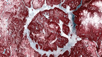 A snowy landscape shows red rocks with white snow interspersed to create a muscle-y, meaty image