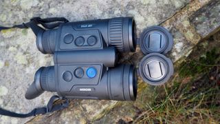 Pulsar Merger LRF XP35 binoculars on a grassy surface