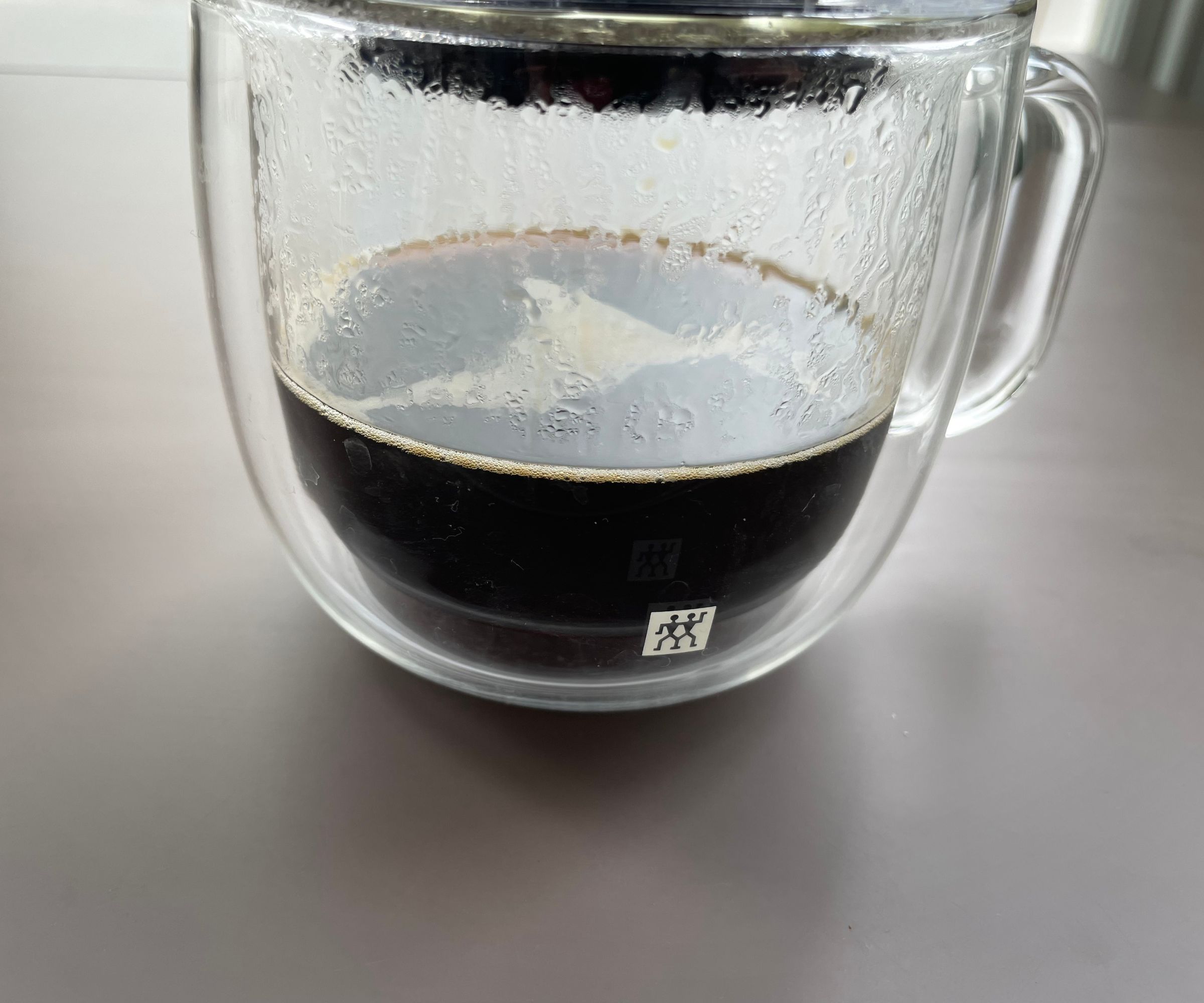 Brewing coffee from the AeroPress into the cup following The Ultimate AeroPress Recipe