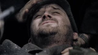 Hoobler lying in pain in Band of Brothers