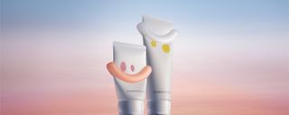 image showing two small tubes of lotion against a sunset-hued background.