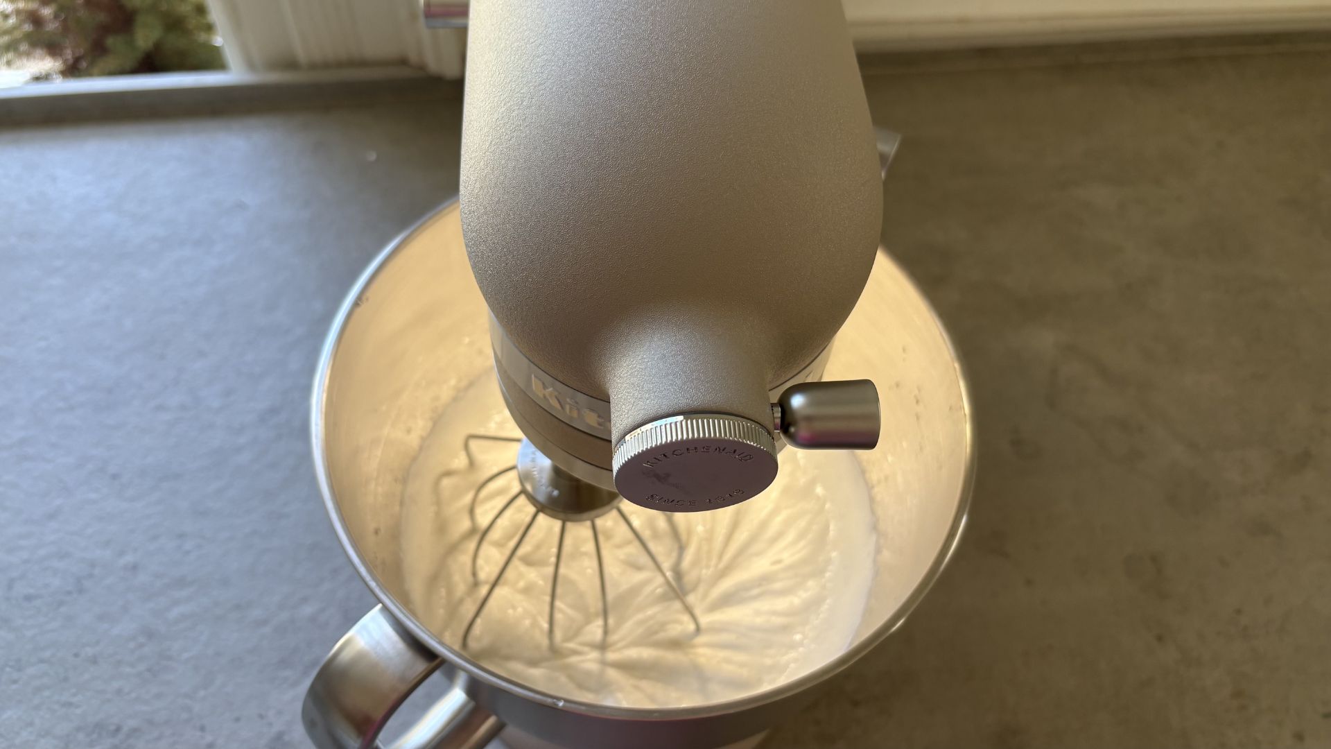 Testing the KitchenAid Artisan Plus Stand Mixer by whipping cream