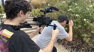 Two students using Sony cameras