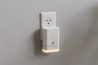 An Amazon Alexa Flex in wall outlet demonstrating the night light function