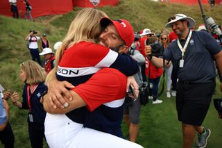 Dustin Johnson and Paulina Gretzky embrace