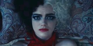 Emma Stone as Cruella de vil laying in bed 2021 live-action origin story