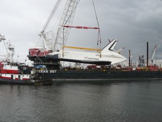 Enterprise Being Hoisted by Crane