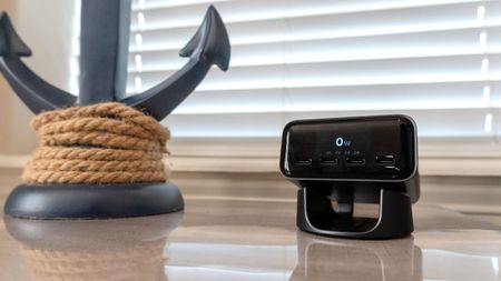 The Satechi ChargeView 140W Desktop Charger on an end table next to a nautical-themed lamp