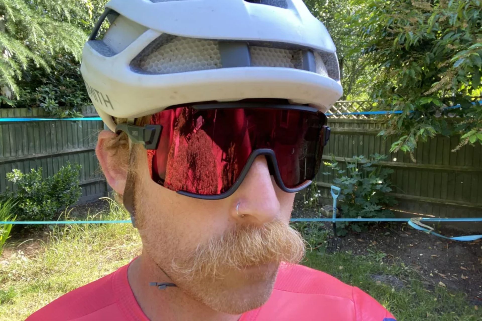 Image shows a rider wearing the Smith Wildcat cycling sunglasses