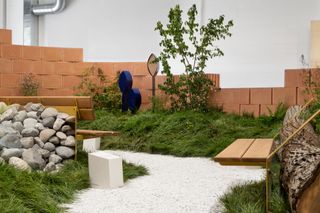 installation with bricks and plants by Vestre