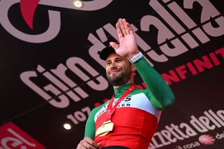DESENZANO DEL GARDA ITALY MAY 18 Filippo Ganna of Italy and Team INEOS Grenadiers celebrates at podium as stage winner during the 107th Giro dItalia 2024 Stage 14 a 312km individual time trial stage from Castiglione delle Stiviere to Desenzano del Garda UCIWT on May 18 2024 in Desenzano del Garda Italy Photo by Dario BelingheriGetty Images