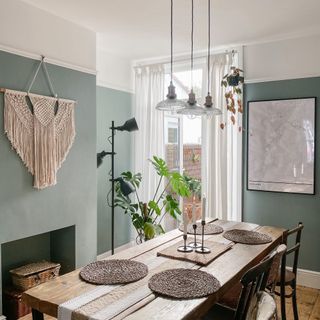 dining room table with three glass pendant lights