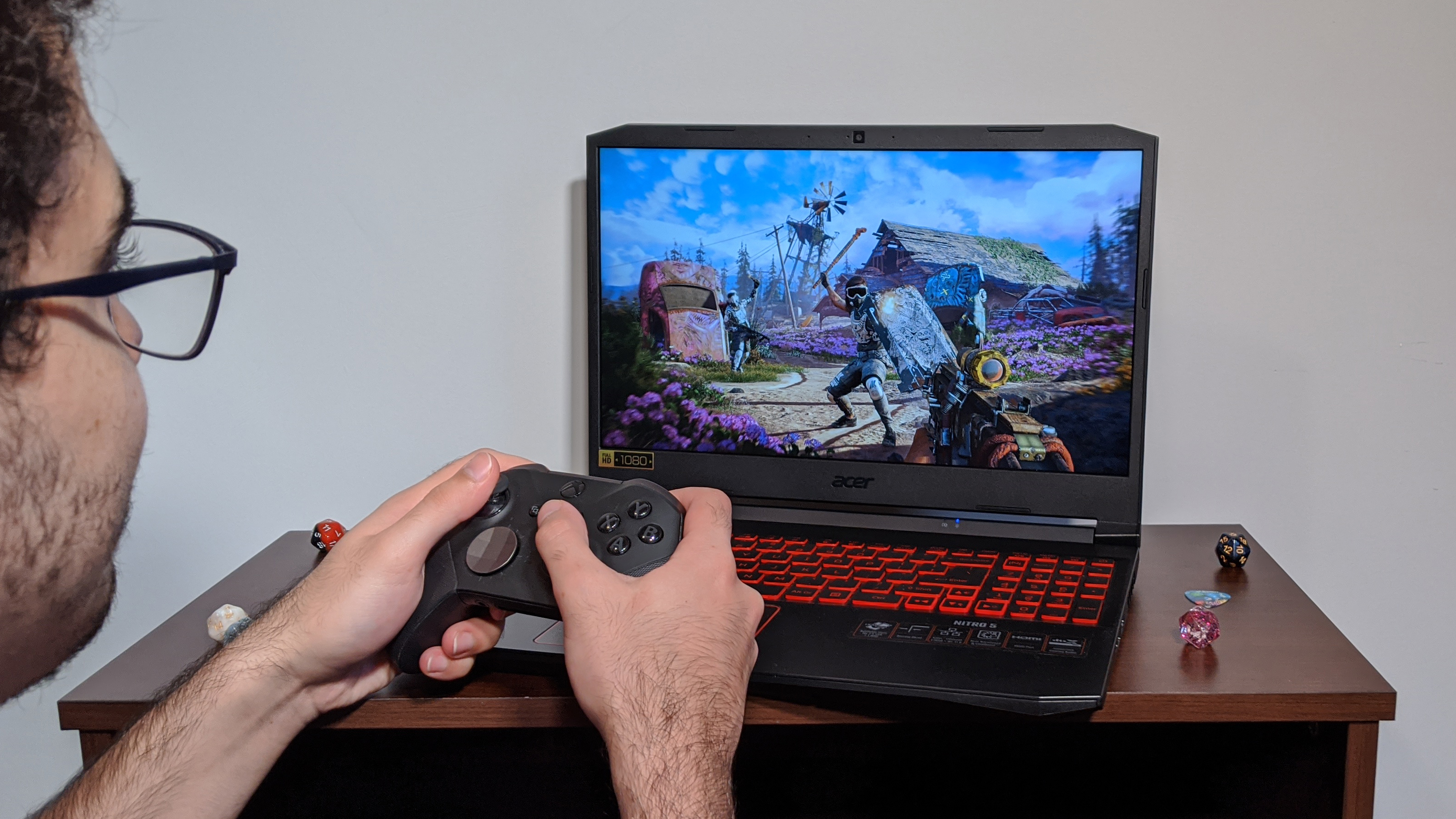 Acer Nitro 5 (AMD, 2022) gaming with a controller