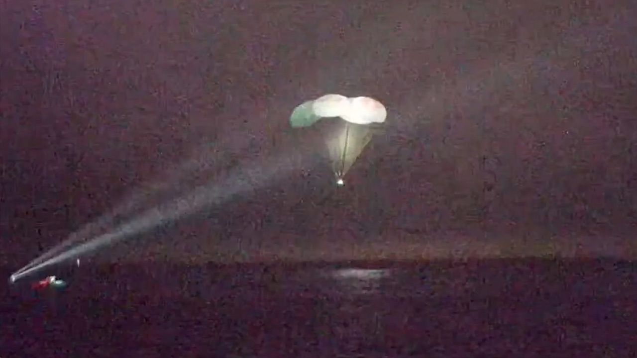 Space's Crew-5 Dragon Endurance descends to Earth under four main parachutes for a successful splashdown in the Gulf of Mexico on March 11, 2023.
