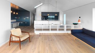 pale matt wooden floor in open plan kitchen living room