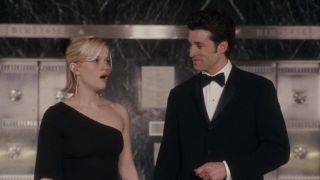 Reese Witherspoon looking surprised next to Patrick Dempsey at Tiffany & Co. in Sweet Home Alabama