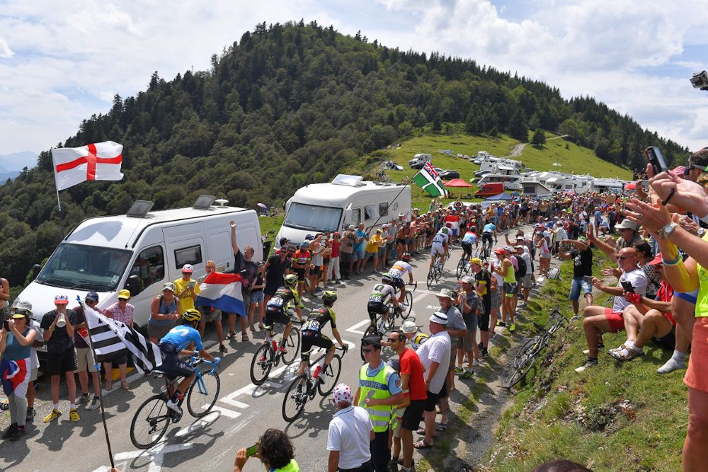 The peloton climbs during stage 19