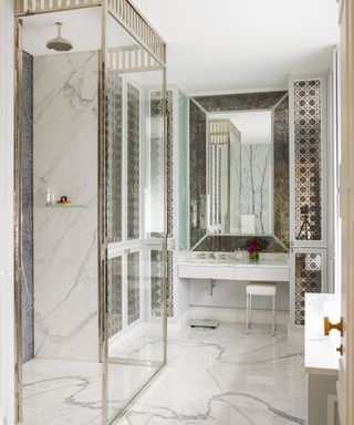 Bathroom with bespoke nickel frame and marble floor and splashback in Edwardian house in West London designed by Philip Vergeylen of Nicholas Haslam