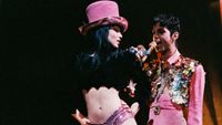 LONDON, UNITED KINGDOM - MARCH 4: Mayte Garcia and Prince perform on stage on 'The Ultimate Live Experience' tour at Wembley Arena on March 4th, 1995 in London, United Kingdom. (Photo by Pete Still/Redferns)